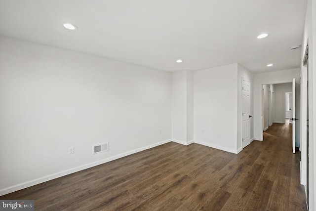 empty room with dark hardwood / wood-style floors