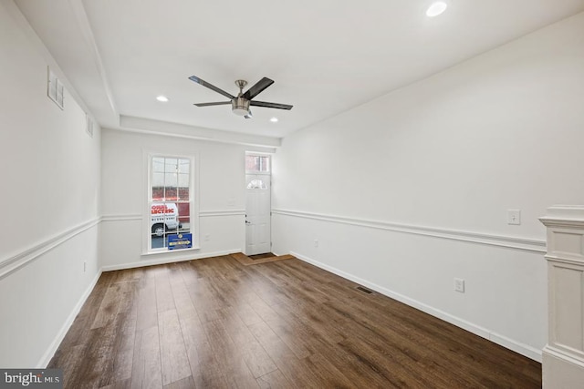 unfurnished room featuring dark hardwood / wood-style flooring and ceiling fan