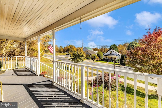 wooden terrace featuring a porch