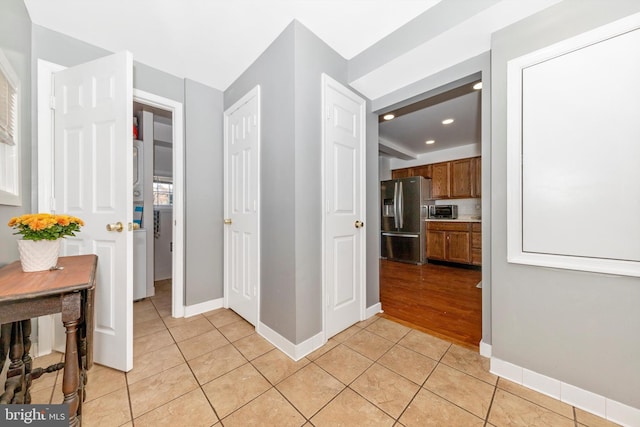 corridor featuring light tile patterned flooring