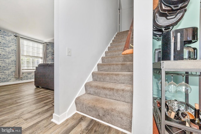 stairs with wood-type flooring