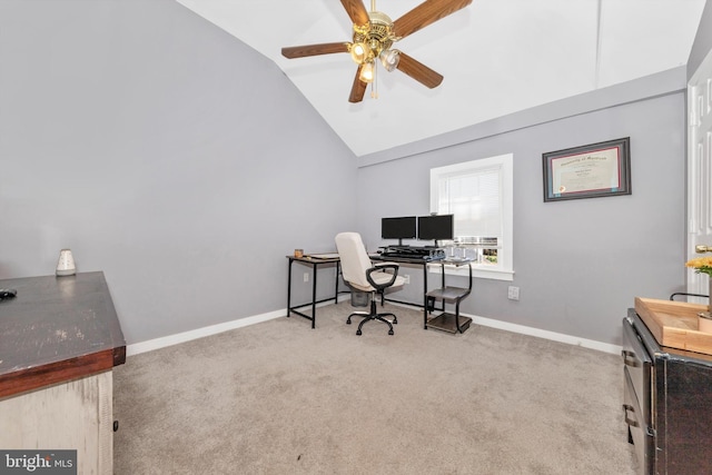 office area featuring light carpet, ceiling fan, and lofted ceiling