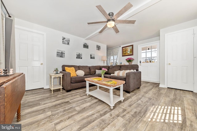 living room featuring ceiling fan and light wood-type flooring