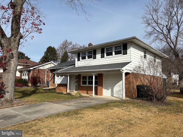 view of front of house featuring a garage and a front yard