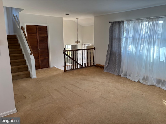 unfurnished room featuring carpet flooring and a wealth of natural light