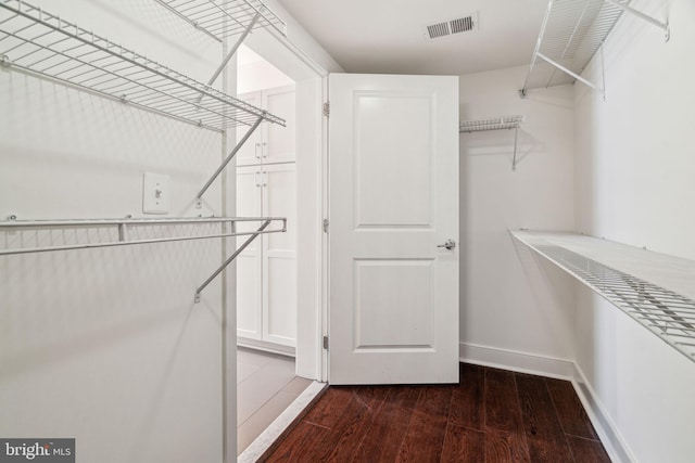 spacious closet with visible vents and wood finished floors