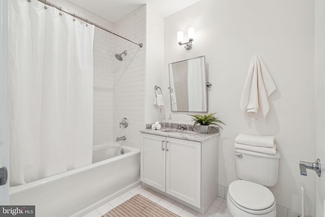 bathroom with tile patterned flooring, toilet, vanity, and shower / bath combo