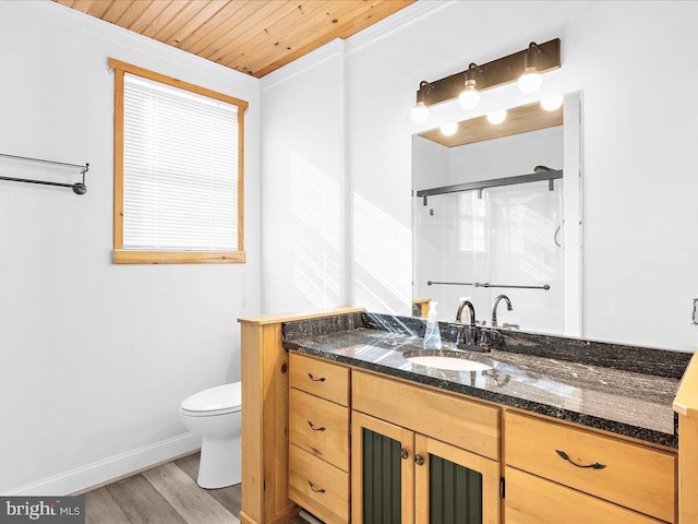 bathroom with hardwood / wood-style floors, a shower with door, wooden ceiling, toilet, and ornamental molding