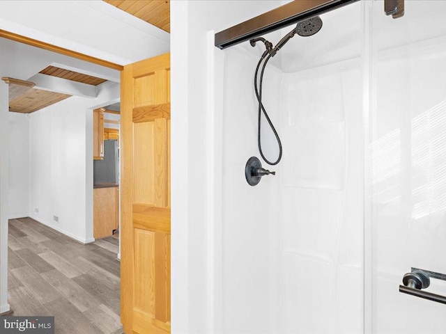 bathroom with hardwood / wood-style floors, walk in shower, and wooden ceiling