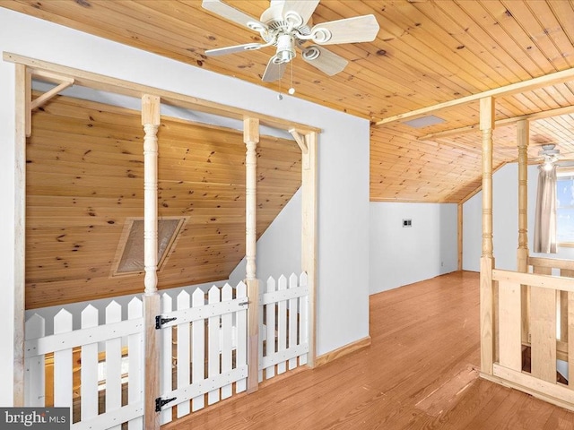 bonus room featuring wood-type flooring, wooden ceiling, ceiling fan, and lofted ceiling