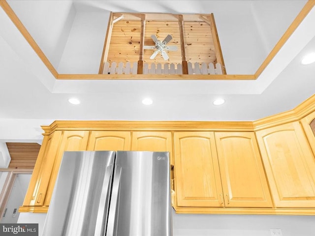 details featuring stainless steel fridge, light brown cabinets, and ceiling fan