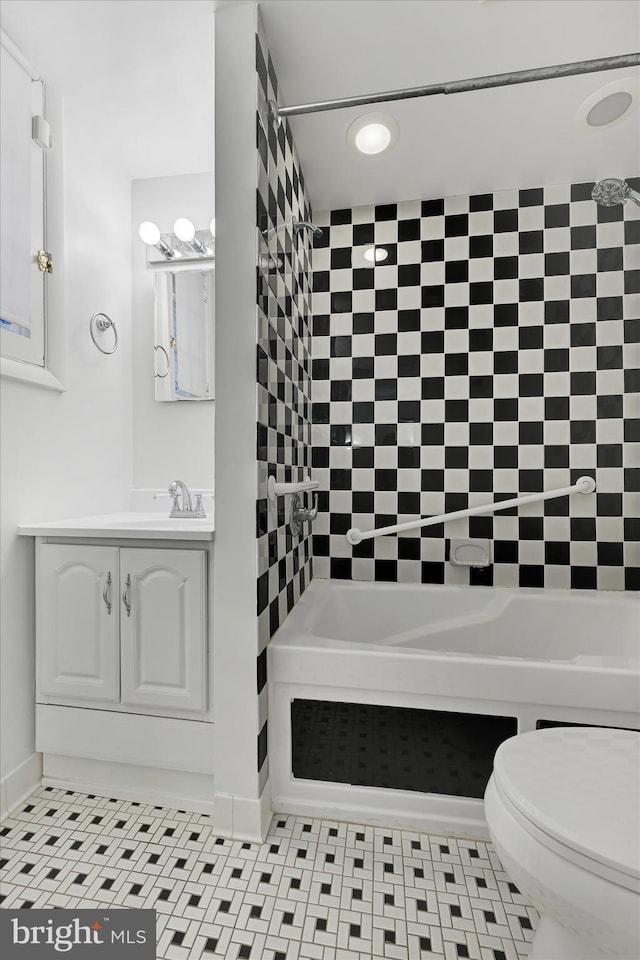 bathroom with tile patterned floors, vanity, and toilet