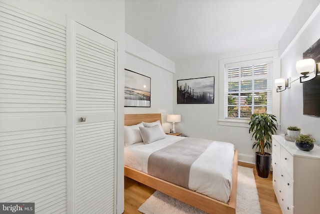 bedroom with light hardwood / wood-style flooring