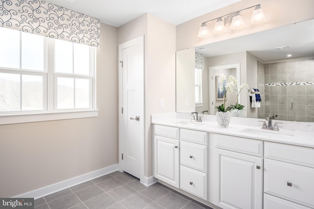 bathroom featuring tile patterned floors, vanity, and an enclosed shower