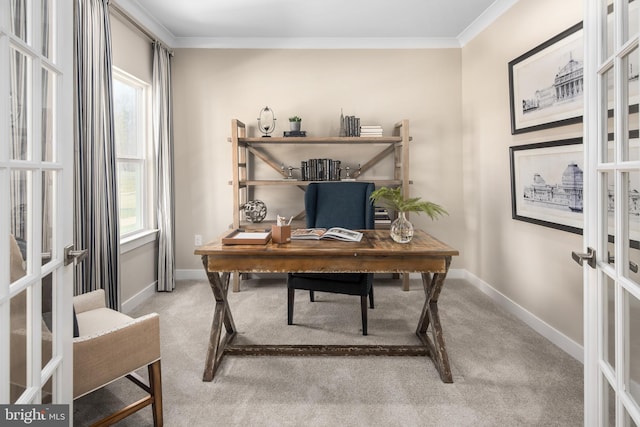 office area with a wealth of natural light, french doors, carpet floors, and ornamental molding