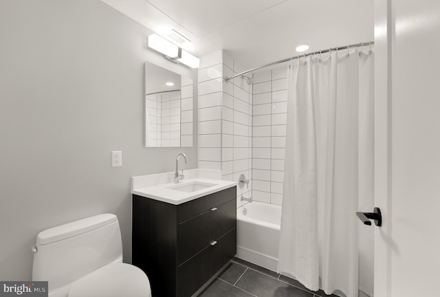 full bathroom featuring tile patterned floors, shower / tub combo with curtain, vanity, and toilet