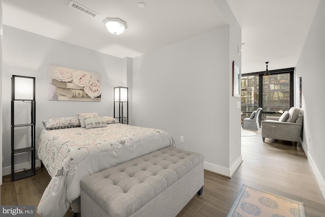 bedroom featuring hardwood / wood-style flooring