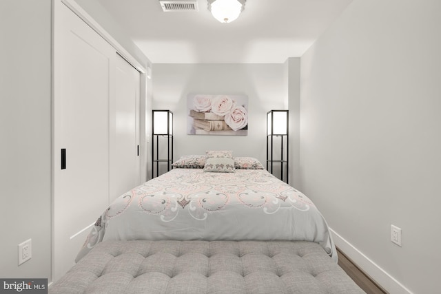 bedroom featuring a closet and light hardwood / wood-style flooring