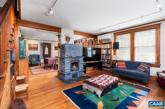 living room with wood-type flooring and track lighting