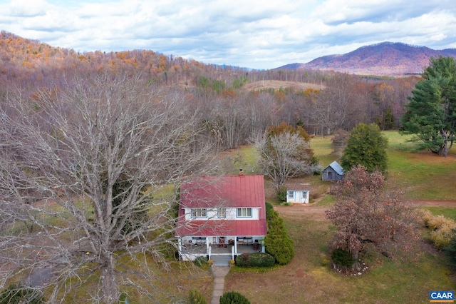 birds eye view of property featuring a mountain view