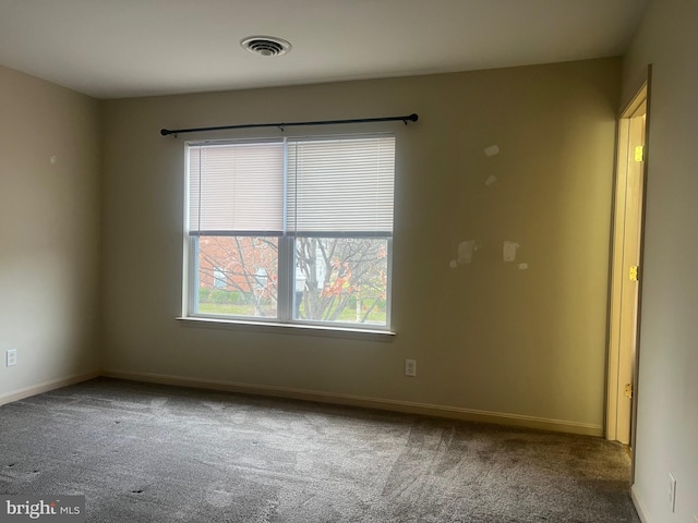 empty room featuring carpet floors