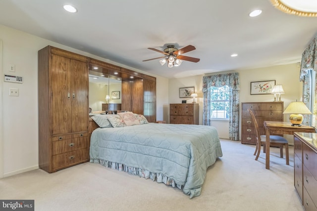 carpeted bedroom with ceiling fan