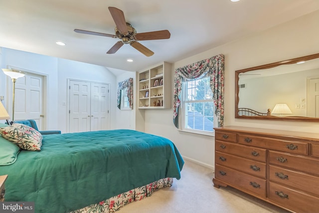 carpeted bedroom featuring a closet and ceiling fan