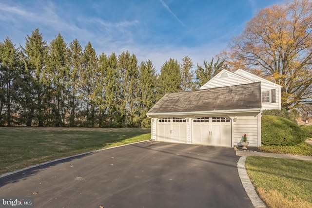 garage with a lawn