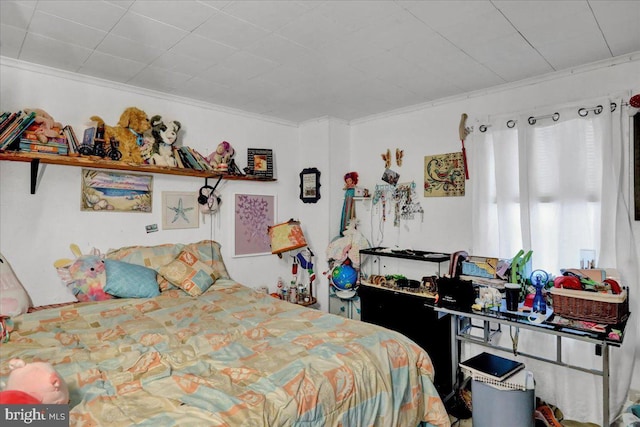 bedroom with crown molding