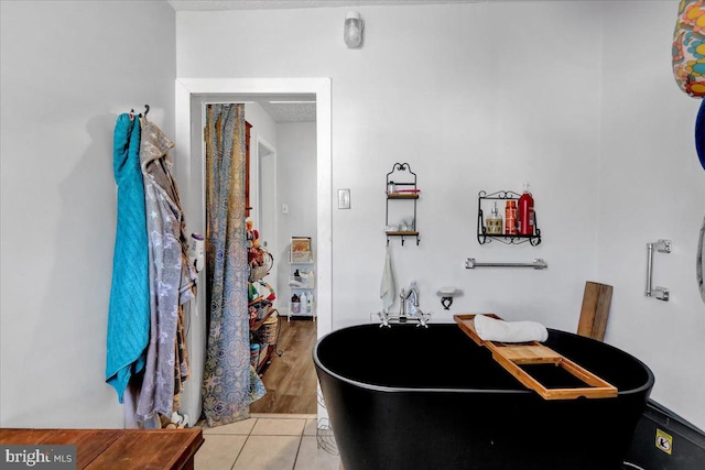 bathroom with tile patterned floors