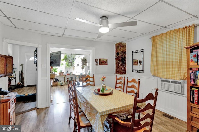 dining room featuring a paneled ceiling, ceiling fan, and light hardwood / wood-style floors