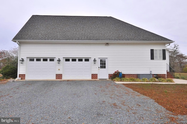 view of side of property with a garage