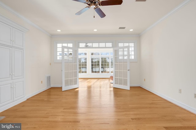 unfurnished living room featuring french doors, light hardwood / wood-style floors, and plenty of natural light