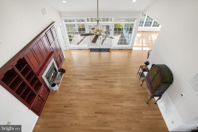 interior space featuring light wood-type flooring and ceiling fan