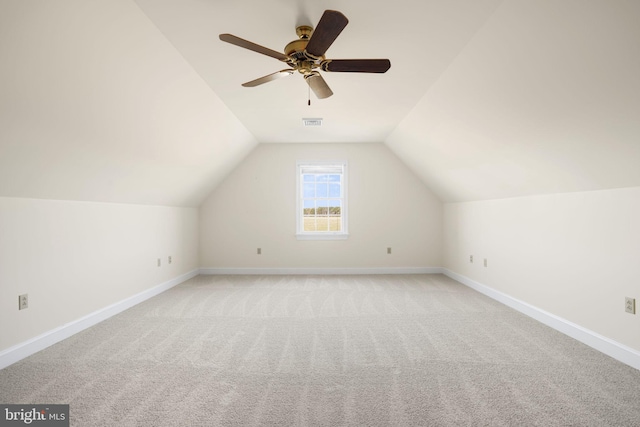 bonus room with ceiling fan, light carpet, and lofted ceiling