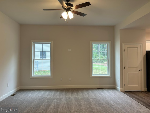 unfurnished room with wood-type flooring and ceiling fan