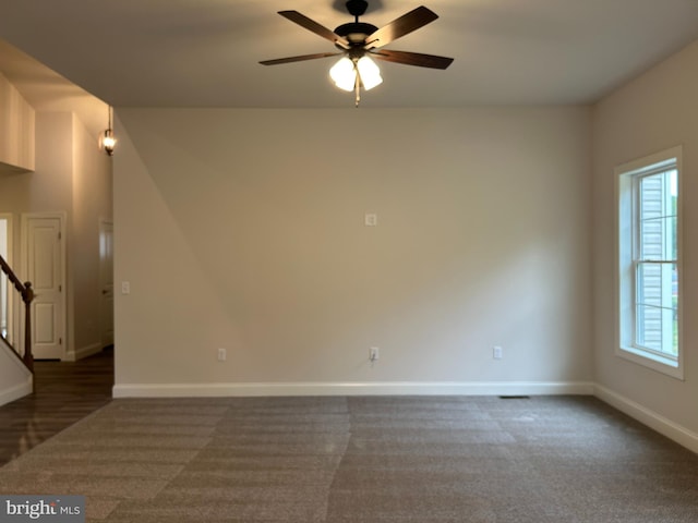 carpeted empty room with ceiling fan