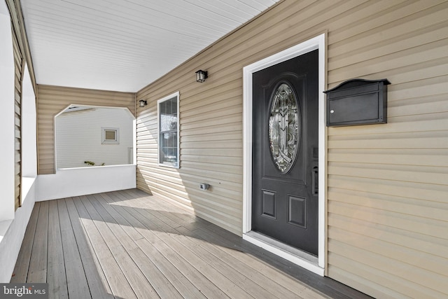 doorway to property featuring a porch