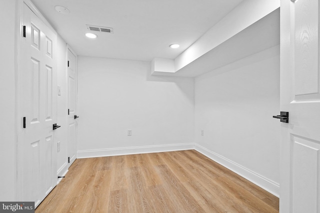 basement featuring light wood-type flooring