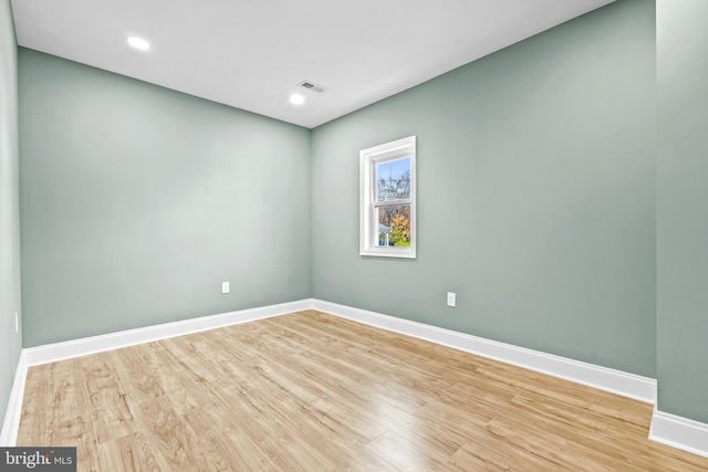 spare room featuring light wood-type flooring