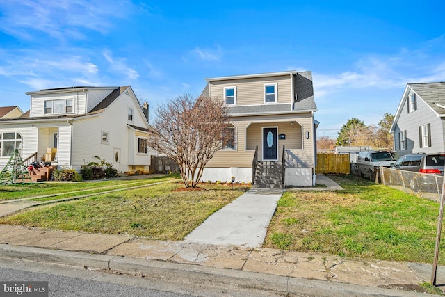 view of front of home with a front lawn