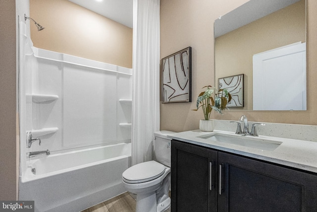 full bathroom with hardwood / wood-style floors, shower / bath combo, toilet, and vanity