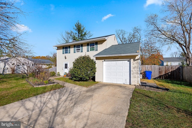 view of front facade with a front yard and a garage