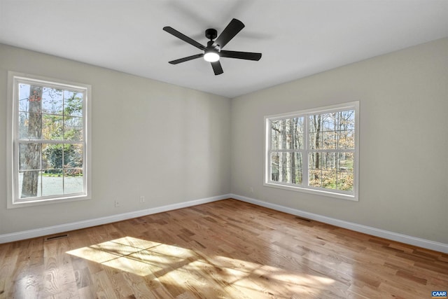 unfurnished room featuring light hardwood / wood-style floors and ceiling fan