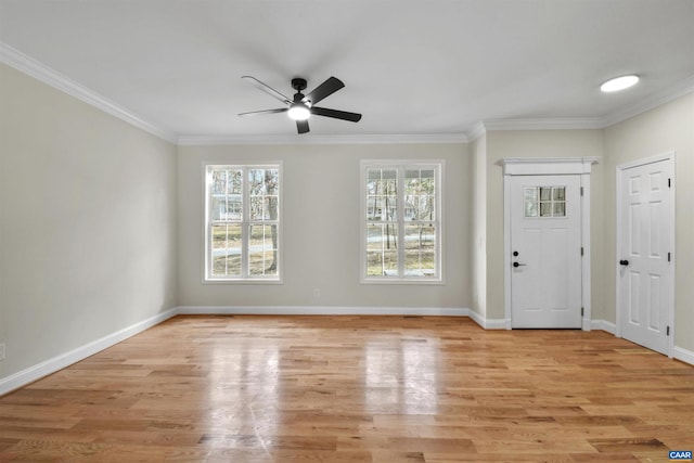 entryway with crown molding, light hardwood / wood-style flooring, and ceiling fan