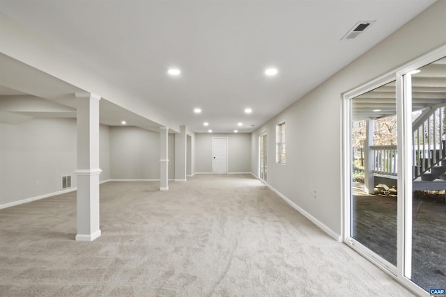 basement featuring light carpet