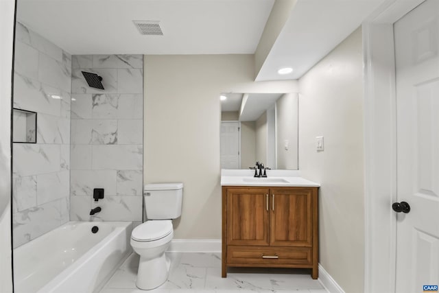 full bathroom with vanity, toilet, and tiled shower / bath