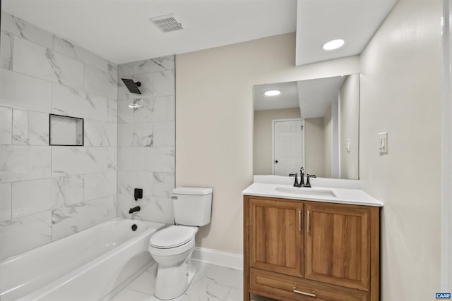 full bathroom featuring vanity, toilet, and tiled shower / bath