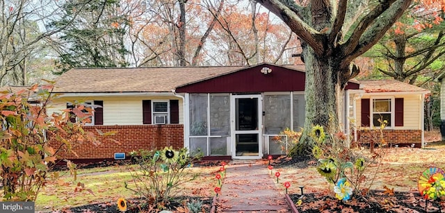 view of front of property with a sunroom