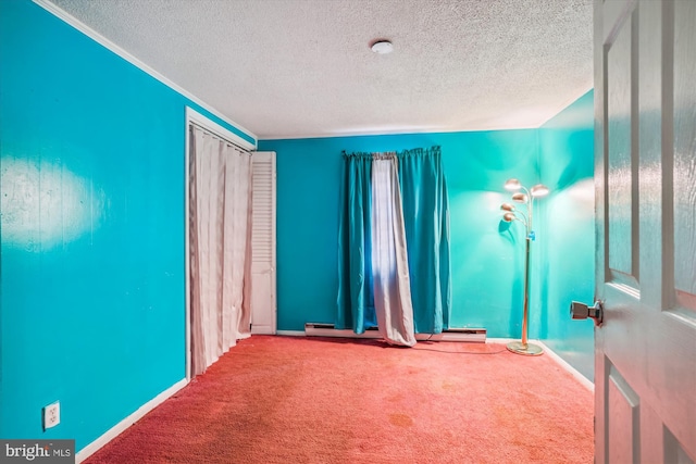 carpeted empty room with a textured ceiling